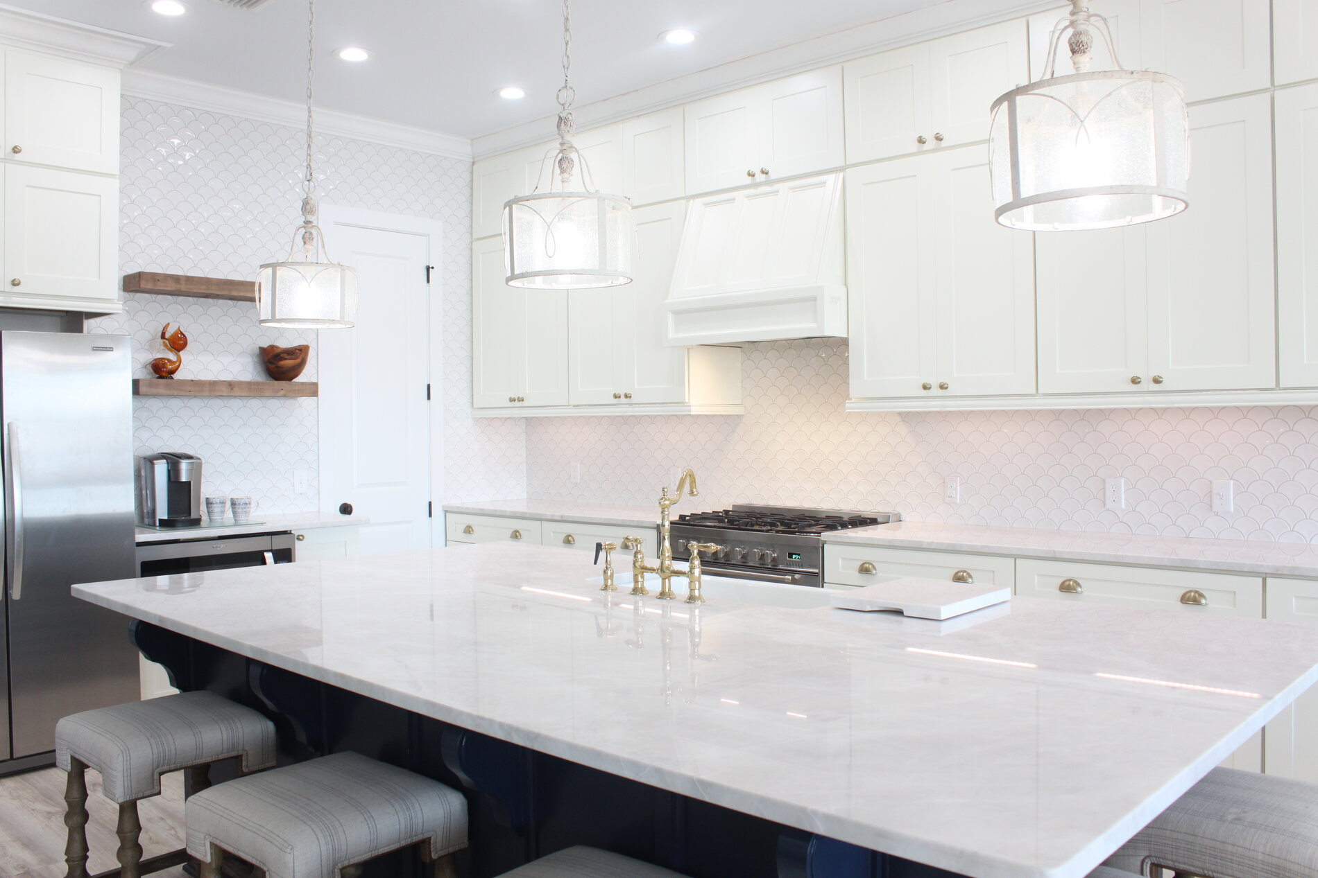 White marble island kitchen by Island Granite